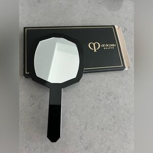 Cle de Peau Beaute hand mirror. Portable and elegant for every day use. Makeup.